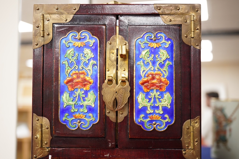 A Chinese brass mounted jewellery cabinet, decorated with enamel plaques. 21cm high. Condition - generally good